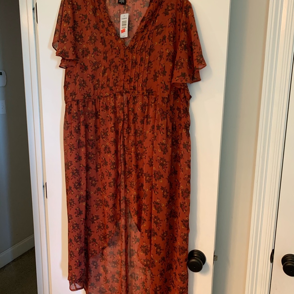 Torrid hi-lo tunic with button- front.